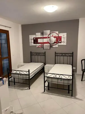 Letto o letti in una camera di Affitta Camere DA MARIA 1