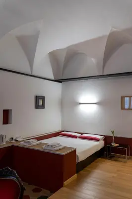 Letto o letti in una camera di Parma, Antico Studio dietro al Battistero