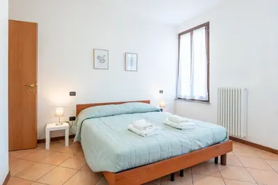 Letto o letti in una camera di GuestHost - Casa Emilia - cozy apartment in Parma