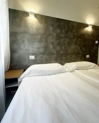 Letto o letti in una camera di Albergo del Pozzo