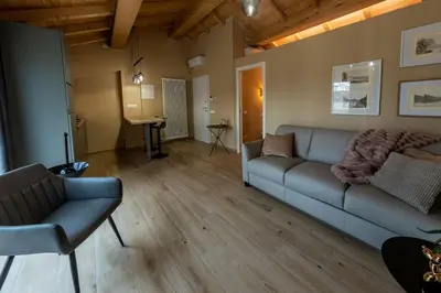 Area soggiorno di Bright Hall apartment Reggio Emilia Centro Storico