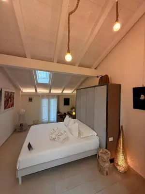 Letto o letti in una camera di ROOMS,REGGIO AFFITTACAMERE con Bagno Privato, TV, Clima , Wi-Fi