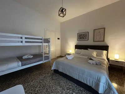 Letto o letti in una camera di Bilocale moderno centro Mantova