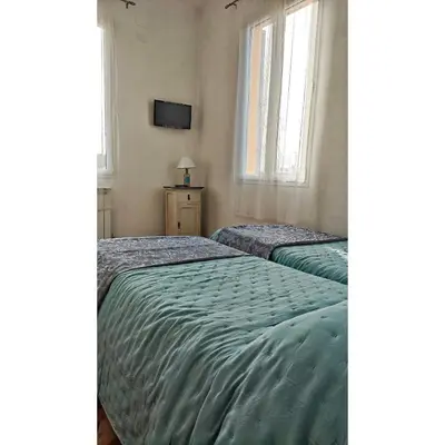 Letto o letti in una camera di Affittacamere Les chambres