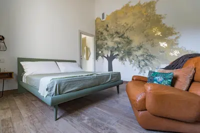 Letto o letti in una camera di Saranto, Maison du Charme - La Tua Oasi nel Verde dell'Emilia