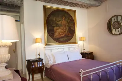 Letto o letti in una camera di Le Stanze del Cardinale