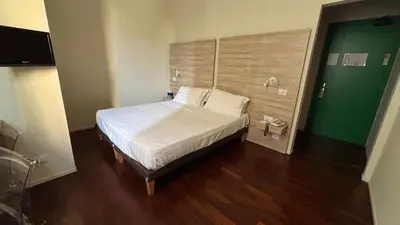 Letto o letti in una camera di Albergo Anelli