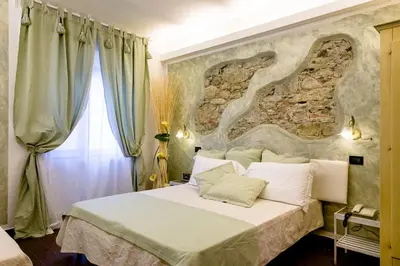 Letto o letti in una camera di Hotel Marina