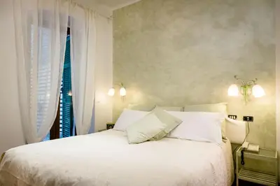 Letto o letti in una camera di Hotel Marina