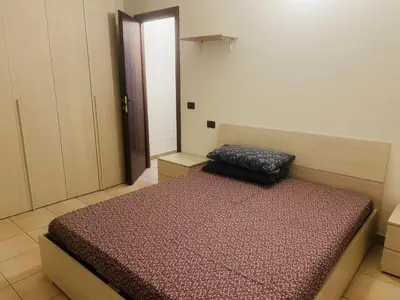 Letto o letti in una camera di Via Brescia