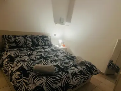 Letto o letti in una camera di Via Brescia
