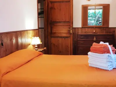 Letto o letti in una camera di Villaggio Barilari