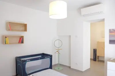 Letto o letti in una camera di Riva Ponente