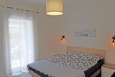 Letto o letti in una camera di Riva Ponente
