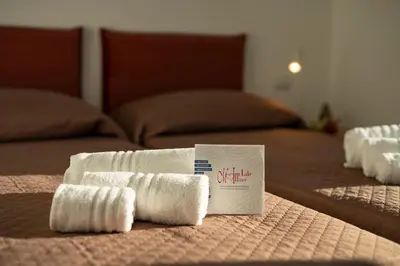 Letto o letti in una camera di Residence - LA ROSA DEI VENTI