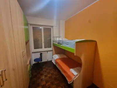 Letto o letti in una camera di Casa Via Asti