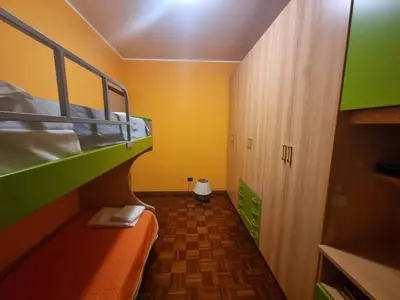 Letto o letti in una camera di Casa Via Asti
