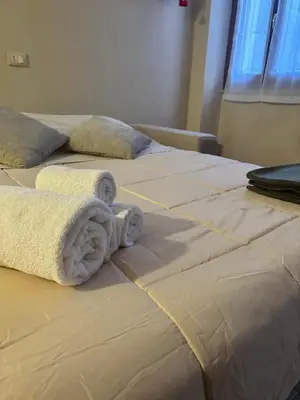 Letto o letti in una camera di Nocciolino Home