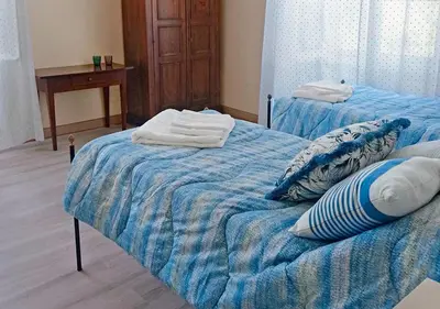 Letto o letti in una camera di Villa Adele