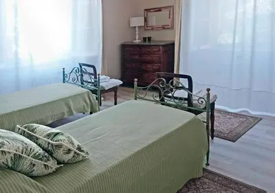 Letto o letti in una camera di Villa Adele