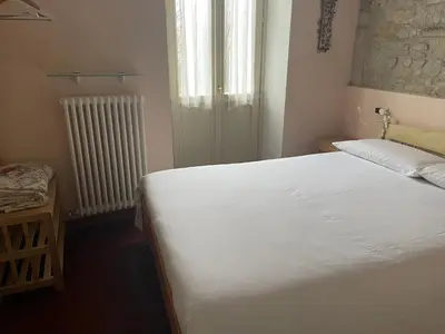 Letto o letti in una camera di Torre dei Magnani