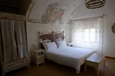Letto o letti in una camera di Torre dei Magnani