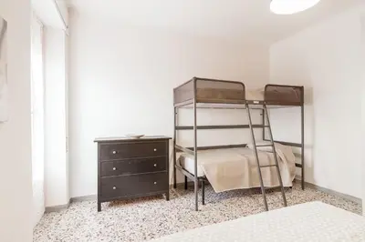 Letto o letti in una camera di La perla sul mare, Levanto