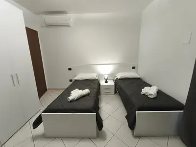 Letto o letti in una camera di Atmosphere Guest House Rubiera