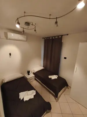 Letto o letti in una camera di Atmosphere Guest House Rubiera