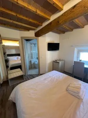 Letto o letti in una camera di B&B Luna Suite & Room