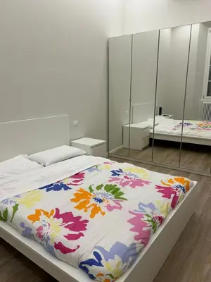 Letto o letti in una camera di Les Suites di Parma - Cavour
