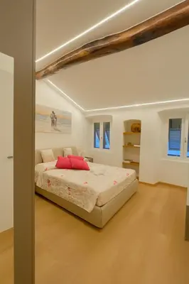 Letto o letti in una camera di WELCOME RIVIERA- Mazzini 77 con WIFI, condizionamento in ogni stanza, parcheggio a pagamento 15euro al giorno da prenotare in anticipo