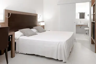 Letto o letti in una camera di Hotel Poli