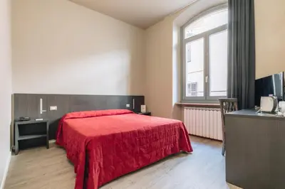 Letto o letti in una camera di Hotel Astoria