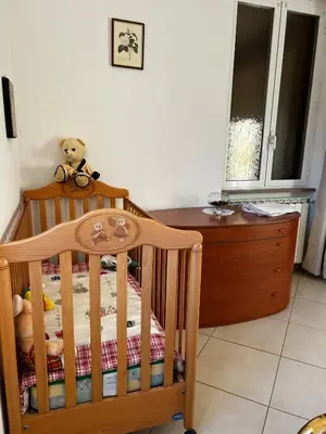 Letto o letti in una camera di Le camelie 2 di Francesca