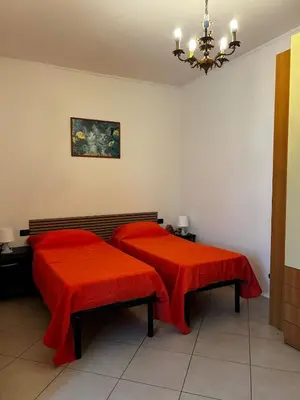 Letto o letti in una camera di Le camelie 2 di Francesca