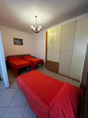 Letto o letti in una camera di Le camelie 2 di Francesca