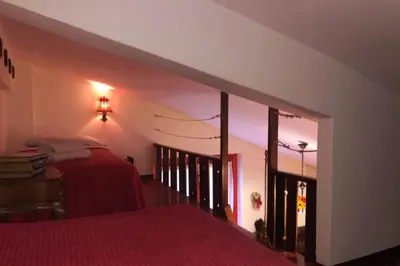 Letto o letti in una camera di appartamento CERRETO LAGHI