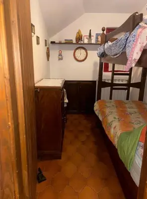 Letto o letti in una camera di appartamento CERRETO LAGHI