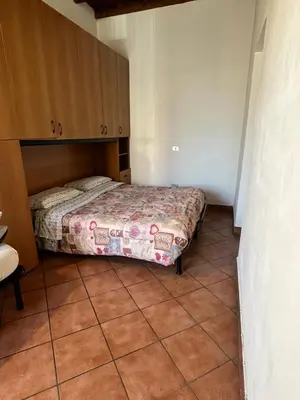 Letto o letti in una camera di maison iris