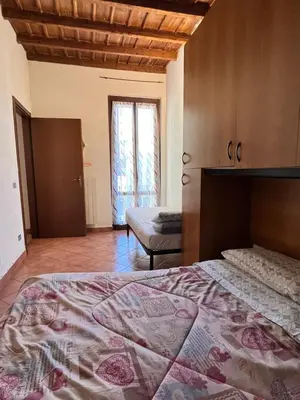 Letto o letti in una camera di maison iris