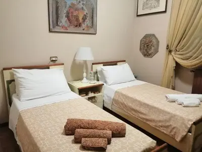 Letto o letti in una camera di B&B La Casa di Rita