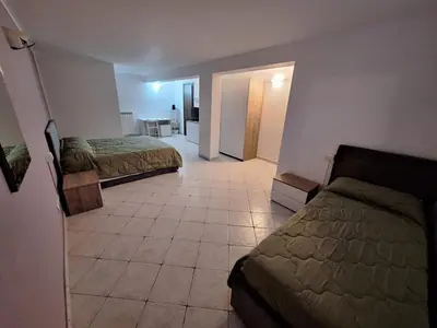 Letto o letti in una camera di Affittacamere Le Rondini 18