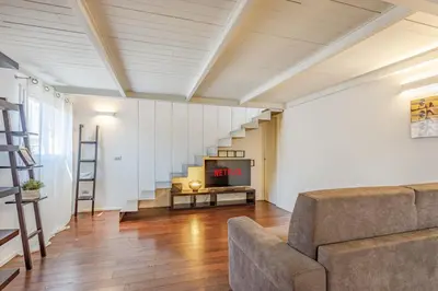Area soggiorno di Ghirlandina Loft - In the Historic Center of Modena