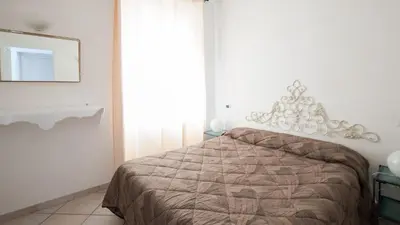 Letto o letti in una camera di Appartamento della Piazza