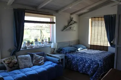 Letto o letti in una camera di Lo Chalet sul Golfo