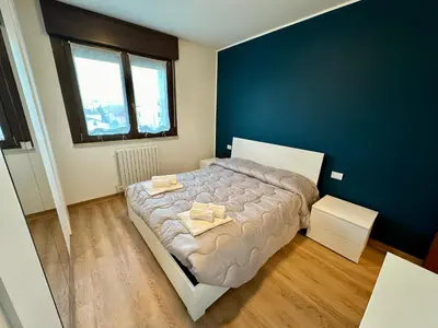 Letto o letti in una camera di Relax nel cuore dell Emilia AlloggiaRE vicino autostrada e RCF Arena