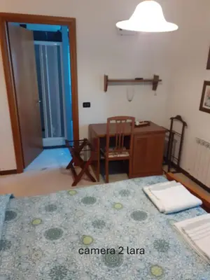 Letto o letti in una camera di Locanda Primo Sole