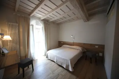 Letto o letti in una camera di 32 BnB Camerecaffè