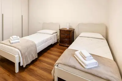 Letto o letti in una camera di Casa Emma